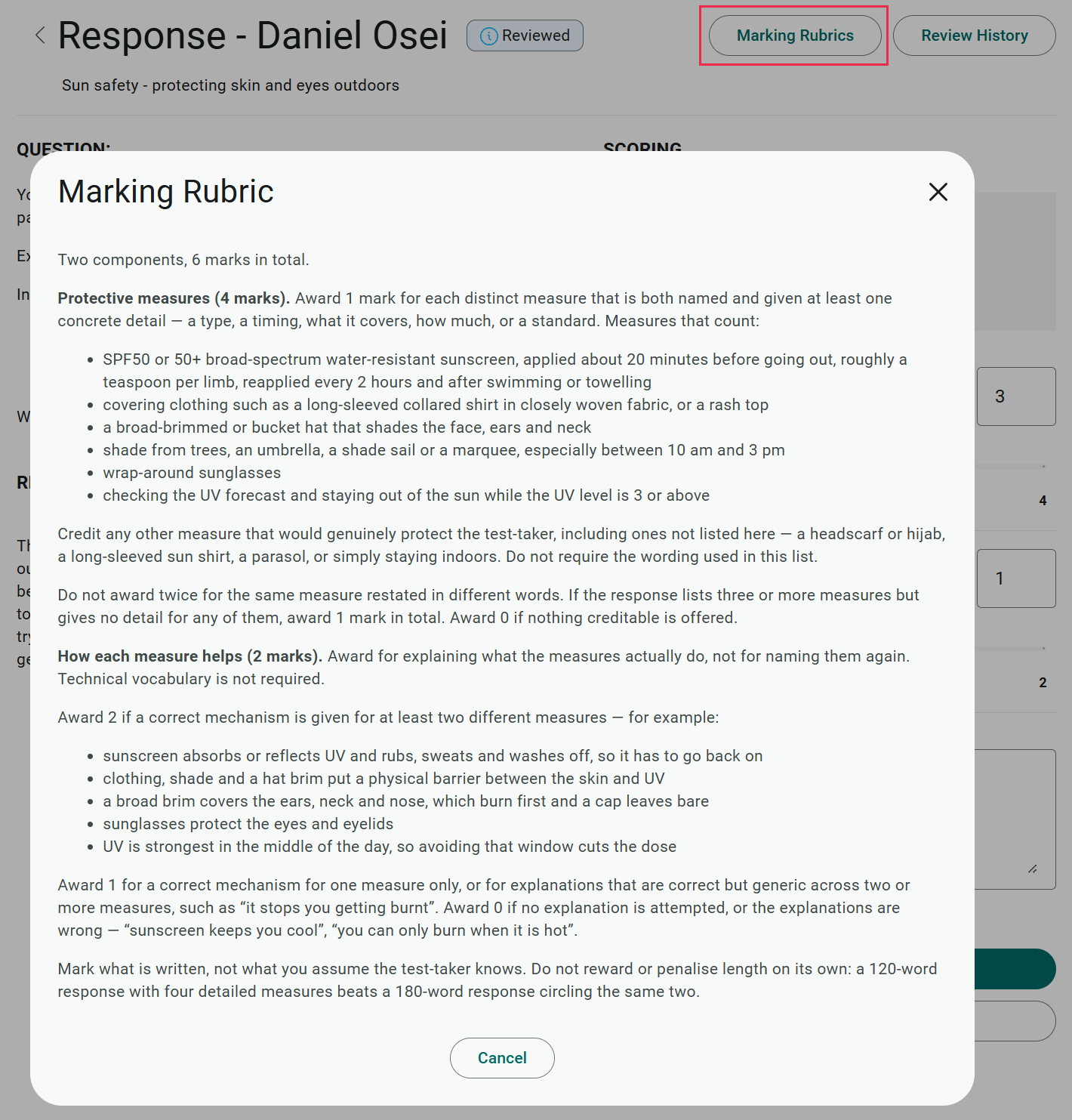 The Marking Rubric panel open over a reviewed response, showing the criteria and mark allocations for both components
