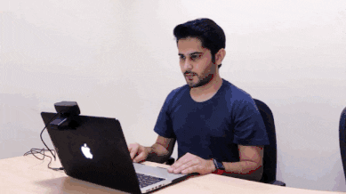 Animation showing a test-taker scanning their desk with an external webcam