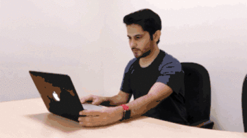 Animation showing a test-taker scanning their desk with an internal laptop webcam